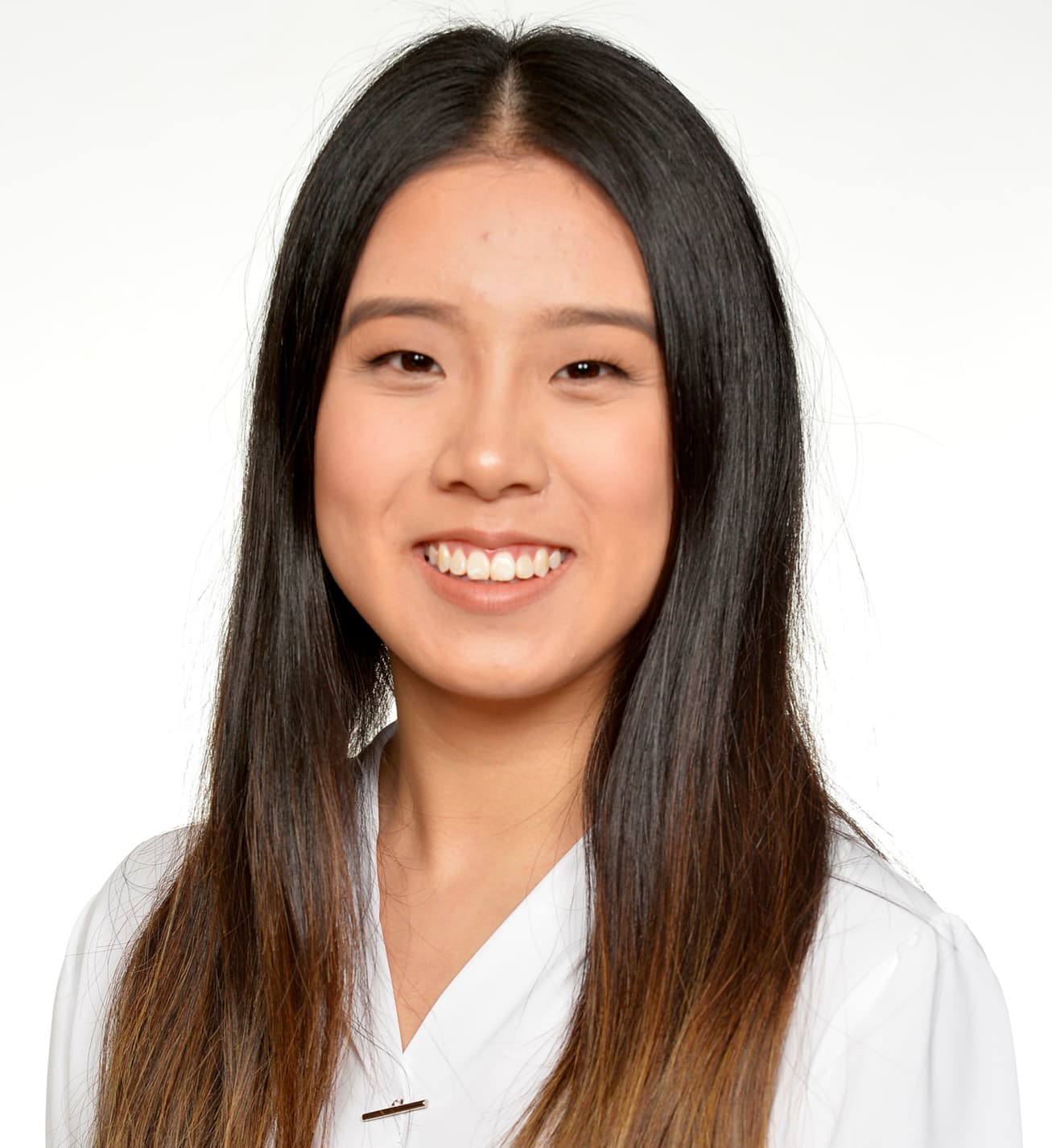A head profile photo of a young asian woman with a plain white background